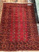 TWO AFGHAN BOKHARA RUGS. 180 x 123 AND 217 x 117cms (2)