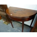 A GEORGE III MAHOGANY DEMILUNE TEA TABLE OPENING ON A DOUBLE GATE, THE SQUARE LEGS CHANNELLED. W