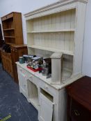 A WHITE PAINTED PINE DRESSER WITH ENCLOSED TWO SHELF BACK, THE BASE WITH AN OPEN SHELF FLANKED BY