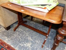 A MAHOGANY COFFEE TABLE, THE RECTANGULAR TOP ROUNDED AT THE CORNERS ABOVE TRIPLE PIERCED PILASTERS