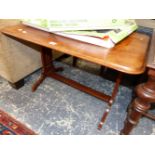 A MAHOGANY COFFEE TABLE, THE RECTANGULAR TOP ROUNDED AT THE CORNERS ABOVE TRIPLE PIERCED PILASTERS