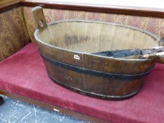 AN ANTIQUE LARGE COOPERED IRON BOUND TUB.