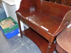 A VICTORIAN MAHOGANY WASH STAND, THE THREE QUARTER GALLERIED RECTANGULAR TOP ABOVE AN APRON DRAWER