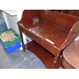 A VICTORIAN MAHOGANY WASH STAND, THE THREE QUARTER GALLERIED RECTANGULAR TOP ABOVE AN APRON DRAWER