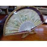 A CASED SILK FAN.