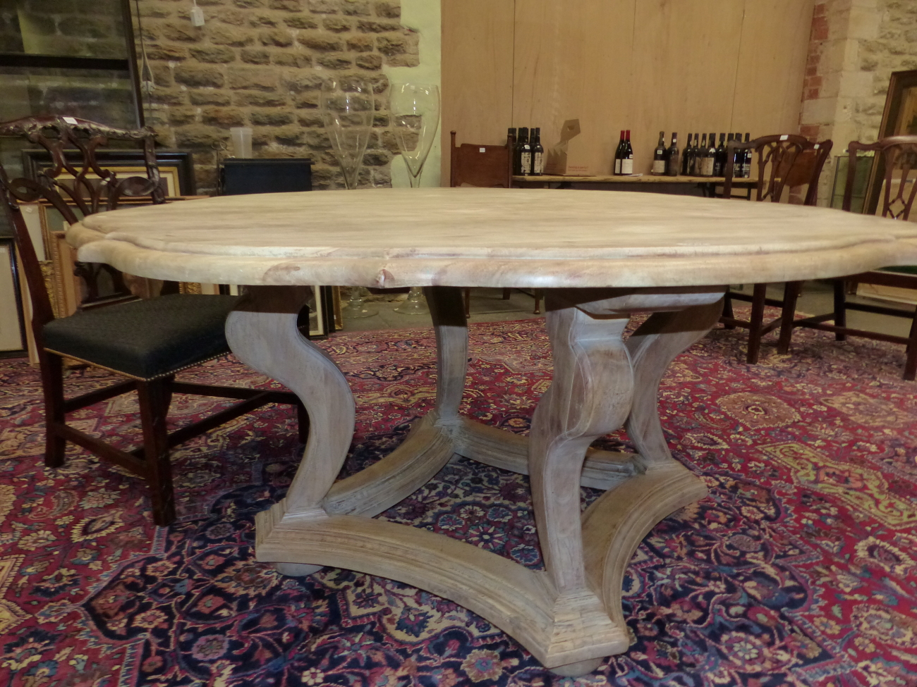A BLEACHED OKA, "TUDOR ROSE" TABLE, THE SHAPED CIRCULAR TOP ON FOUR BRACKET LEGS JOINED BY A STRET - Image 2 of 5