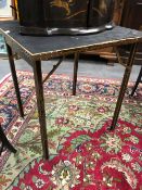 GEORGE VERNON, NEWPORT, R I, A CHINOISERIE GILT EBONISED FOLDING GAMES TABLE, THE TOP. 64 x 64cms.