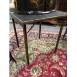 GEORGE VERNON, NEWPORT, R I, A CHINOISERIE GILT EBONISED FOLDING GAMES TABLE, THE TOP. 64 x 64cms.