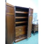 A LATE VICTORIAN WALNUT LINEN PRESS CABINET, THE TWO PANELS TO EACH DOOR THE CORNERS, THE INTERIOR