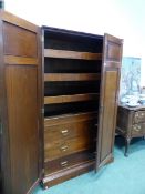 A LATE VICTORIAN WALNUT LINEN PRESS CABINET, THE TWO PANELS TO EACH DOOR THE CORNERS, THE INTERIOR