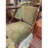 A VICTORIAN WALNUT NURSING CHAIR, THE OLIVE GREEN VELVET UPHOLSTERED RECTANGULAR BACK BETWEEN FLUTED