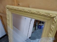 A MODERN RECTANGULAR MIRROR IN A FOLIATE GILT FRAME. TOGETHER WITH A PIANO STOOL