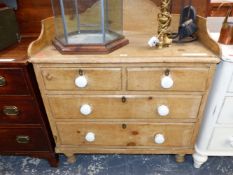 A 19th C. PINE CHEST OF TWO SHORT AND TWO LONG DRAWERS ON TURNED FEET, THE TOP WITH A THREE