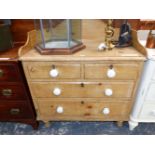 A 19th C. PINE CHEST OF TWO SHORT AND TWO LONG DRAWERS ON TURNED FEET, THE TOP WITH A THREE