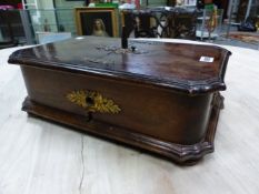 A GERMAN VINTAGE POLYPHON IN A STAINED WOOD CASE AND PLAYING 18cms. METAL DISCS, THE CASE. W 44 x D