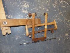 AN OAK MOUNTED FRET SAW ON AN ADJUSTABLE FRAME