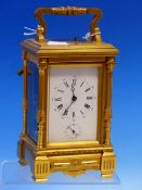 A LATE 19th/EARLY 20th C. CARRIAGE CLOCK WITH ALARM AND STRIKE REPEAT ON COILED RODS. H 18.5cms.