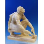 A 19th C. GRAND TOUR WHITE ALABASTER FIGURE OF A MAN LOOKING UP WHILE HONING A KNIFE BLADE, BARE BU