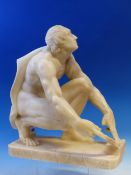 A 19th C. GRAND TOUR WHITE ALABASTER FIGURE OF A MAN LOOKING UP WHILE HONING A KNIFE BLADE, BARE BU