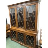 A 19th C. MAHOGANY DISPLAY CABINET WITH A DENTIL CORNICE OVER THREE ASTRAGAL DOORS TO THE TOP AND
