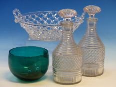 A PAIR OF GEORGE III CUT GLASS HALF BOTTLE DECANTERS AND STOPPERS, A TWO HANDLED TRAILED GLASS BOWL.