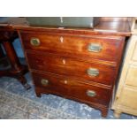 A GEORGE III CROSS BANDED AND LINE INLAID MAHOGANY CHEST OF THREE LONGDRAWERS ON BRACKET FEET. W