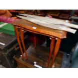 A NEST OF TWO 20th C. CARVED MAHOGANY TABLES.