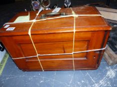 A VINTAGE SEWING MACHINE IN A MAHOGANY CASE.