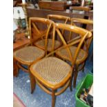 A SET OF FOUR STAINED WOOD CHAIRS WITH X-SHAPED LATH BACKS, CANED SEATS AND CURVED FRONT LEGS