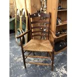 A COUNTRY MADE LADDER BACK RUSH SEAT ARMCHAIR