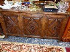 AN 18th C. AND LATER OAK COFFER, THE THREE FRONT PANELS CARVED WITH DIAMONDS IN RELIEF ABOVE THE