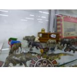 A GROUP OF DIE CAST ZOO ANIMALS AND A MODEL SHOP COUNTER.