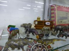 A GROUP OF DIE CAST ZOO ANIMALS AND A MODEL SHOP COUNTER.