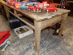 A PINE TABLE, THE PLANK TOP ONCE OVER TWO DRAWERS. W 182 x D 89 x H 77cms.