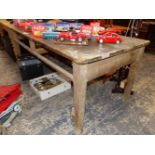 A PINE TABLE, THE PLANK TOP ONCE OVER TWO DRAWERS. W 182 x D 89 x H 77cms.