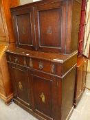 A 19th C. OAK CABINET, THE DOORS TO THE RECESSED TOP AND TO THE BASE WITH PRINTS OF DUTCH CHILDREN.