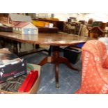 A 19th C. CROSS BANDED MAHOGANY BREAKFAST TABLE WITH A ROUNDED RECTANGULAR TOP ON A COLUMN AND