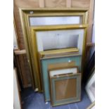 A SMALL COLLECTION OF MOULDED GILT FRAMES AND OTHERS OF VARIOUS SIZES