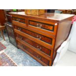 A 19th C. WALNUT CHEST BY GILLOWS, THE TWO SHORT AND THREE GRADED LONG DRAWERS WITH EBONY FRAMED YE