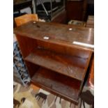 A 19th C. MAHOGANY COMMODE STOOL. W 54 x D 41.5 x H 46cms. TOGETHER WITH AN OPEN BOOK CASE. W 68 x H