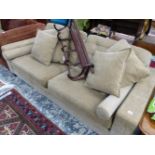 A BEIGE UPHOLSTERED TWO SEAT SETTEE. W 199cms.