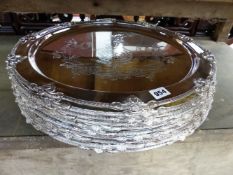 TEN SILVER PLATED ARMORIAL DECORATED PLATTERS.