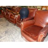 A SET OF FIVE LEATHER UPHOLSTERED CLUB ARMCHAIRS WITH BROWN VELVET CUSHION SEATS