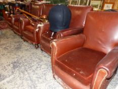 A SET OF FIVE LEATHER UPHOLSTERED CLUB ARMCHAIRS WITH BROWN VELVET CUSHION SEATS