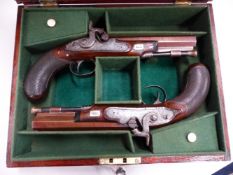 A MAHOGANY CASED PAIR OF SYKES & Co., OXFORD PERCUSSION CAP PISTOLS WITH RAMRODS UNDER THE BROWNED