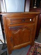 A 19th CENTURY FRENCH CARVED OAK SIDE CABINET.