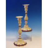 A PAIR OF LATE 18th/EARLY 19th C. ENAMEL CANDLESTICKS, POSSIBLY STAFFORDSHIRE, THE FLUTES OF THE