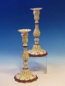 A PAIR OF LATE 18th/EARLY 19th C. ENAMEL CANDLESTICKS, POSSIBLY STAFFORDSHIRE, THE FLUTES OF THE