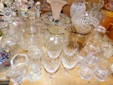 A QUANTITY OF VARIOUS VINTAGE GLASS WARES, INCLUDING VASES, BOWLS, DRINKING WARES AND DECANTERS.