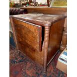 A 19th C. MAHOGANY CUPBOARD, THE TWO DOORS WITH EBONY LINE INLAID OVALS AND OPENING BETWEEN RING